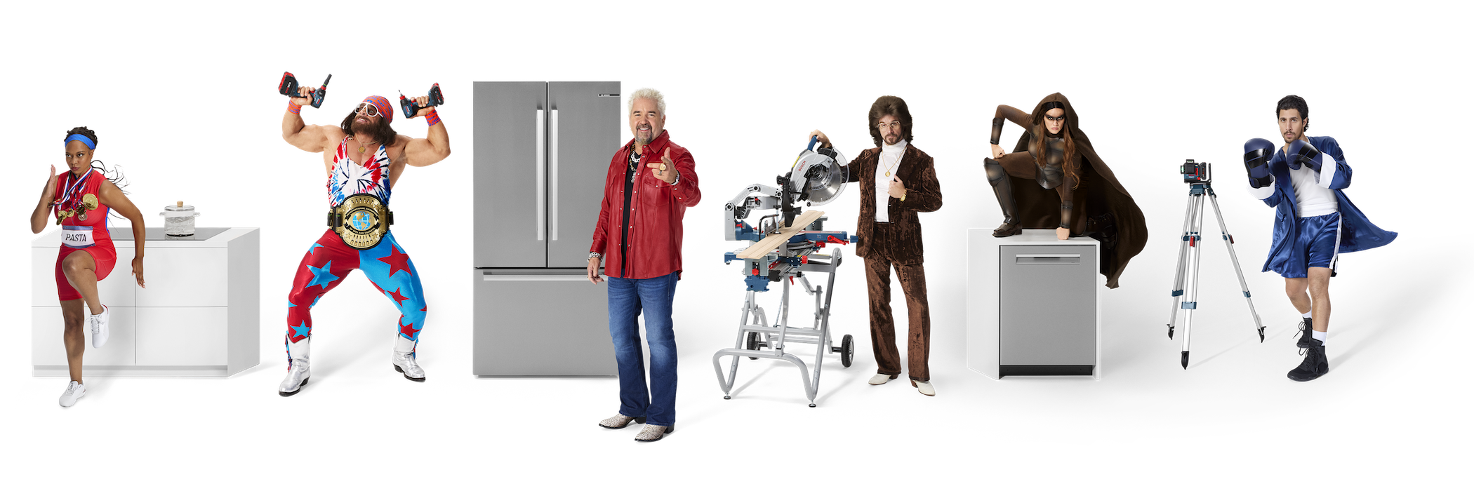 A group shot showcasing the five Like A Bosch heroes. Featuring Guy Fieri next to the Bosch fridge, Macho Man Randy Savage holding two 18V 2-in-1 Impact drivers, the fastest springer lady next to her induction cooktop from Bosch. On the left side we see the smoothest guy on the construction side with his 18V Glide Miter Saw followed by our hero on the Bosch dishwasher.